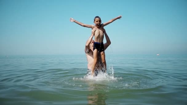 Dad Throws His Son Out Water Playing Him Beach Slow — Stock Video