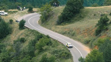 Kocani, Macedonia - 24 Jun, 2018: Custom sport car raceing to the summit during Hill Climb Race clipart