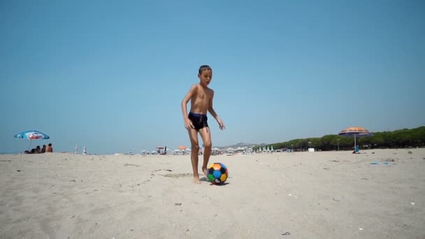 Cheerful Kid Playing Football Running Barefoot Wet Sandy Beach Kicking — Stock Video