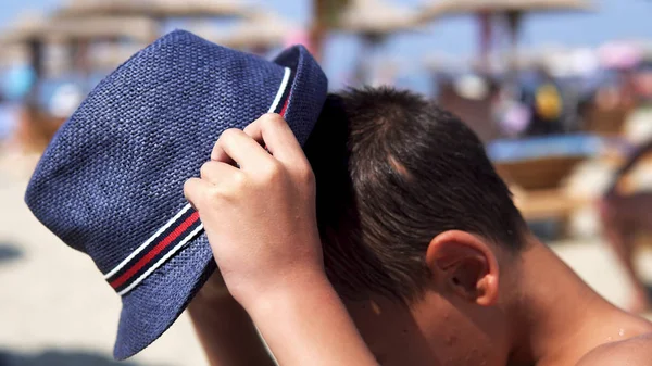 Young Boy Dazzled Summer Sun Beach Put Protection Hat Smile — Stock Photo, Image