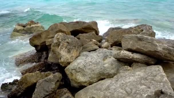 Waves Breaking Stony Beach Forming Spray — Stock Video