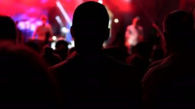 Audience enjoying concert, crane cinematic authentic shot.  Public concert, no ticketing event