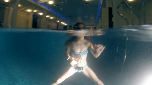 Half Underwater Little Girl Swimming Diving Joyfully Indoor Pool Gopro — Stock Video