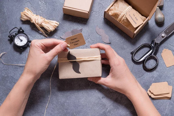 Woman hands wrapping Gift Boxes, Happy Father`s Day concept