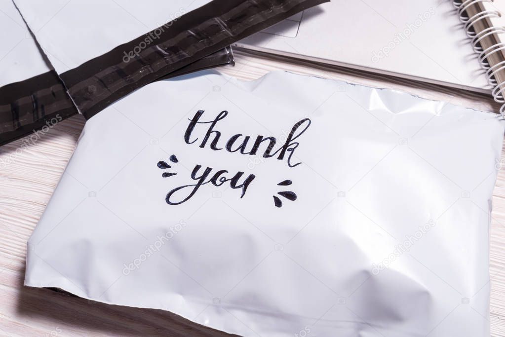 Hand written Thank you text on polyethylene envelope 