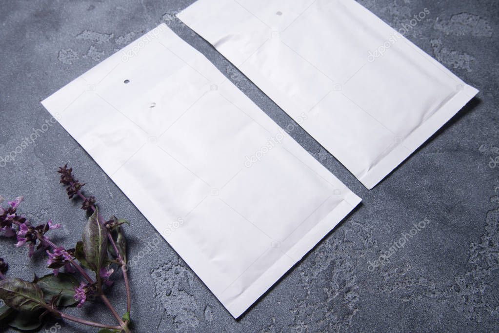 Set of two padded envelopes on gray background