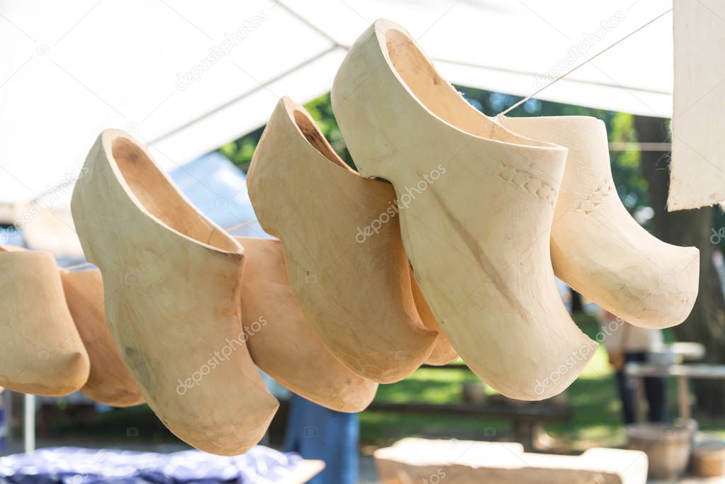 Traditional wooden dutch shoes in street market