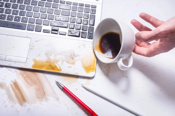 Spill coffee on a computer keyboard