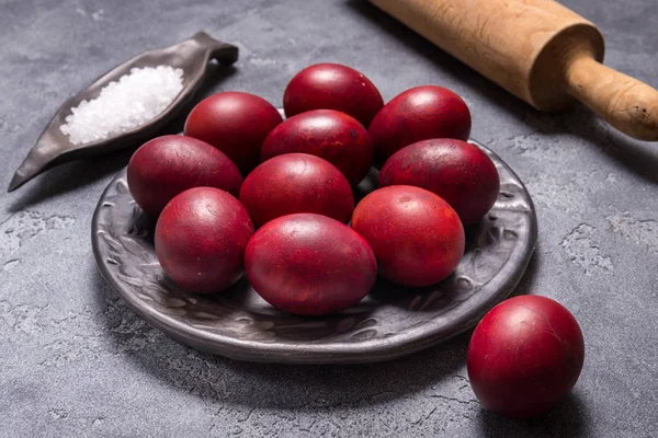 Eggs painted in onion skins in black ceramic plate