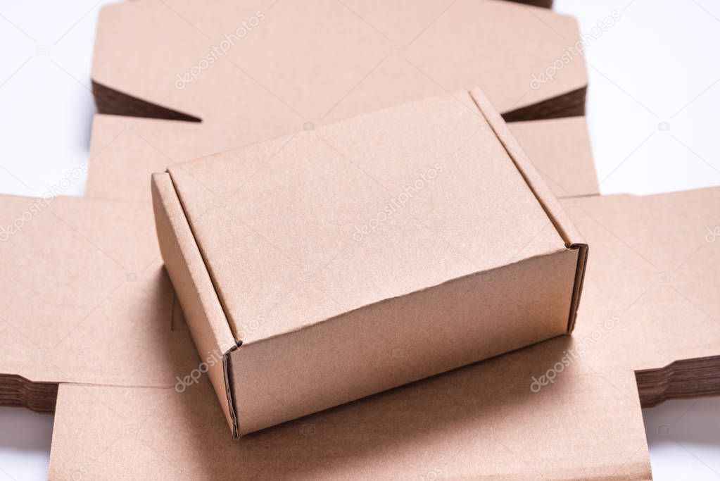 Craft brown carton Cardboard boxes on white background, industrial