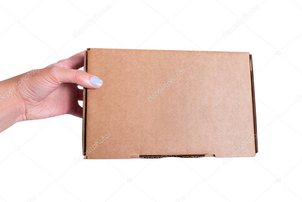 Brown craft cardboard box in woman hand, isolates