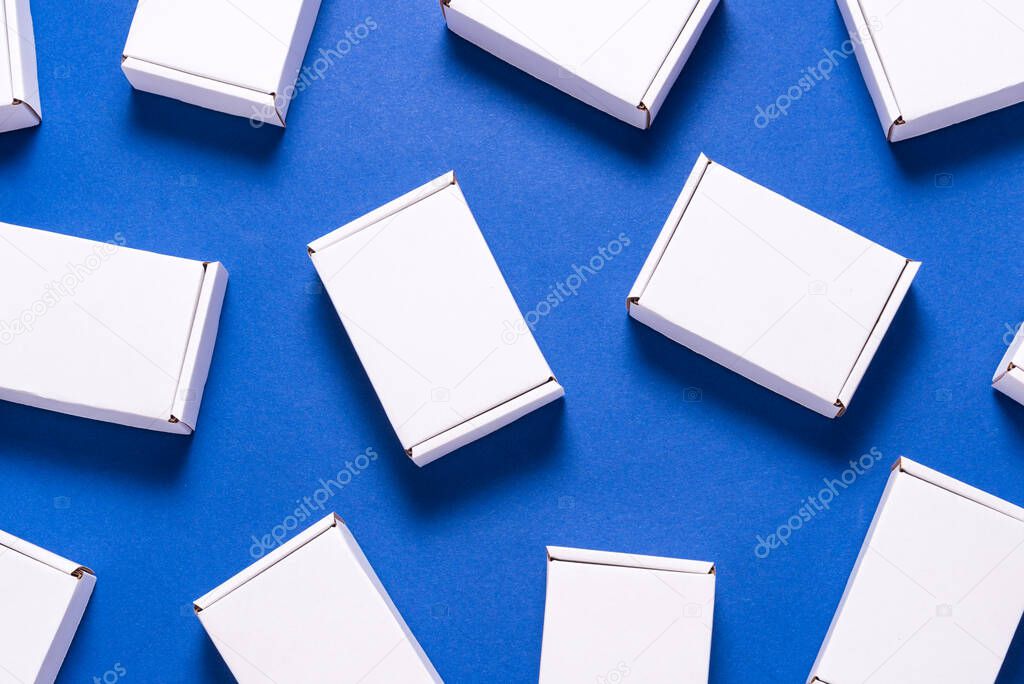 Lot of square carton boxes on blue background