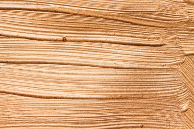 Kremsi temel dokusunun metalik parlak kahverengi makyaj lekeleri