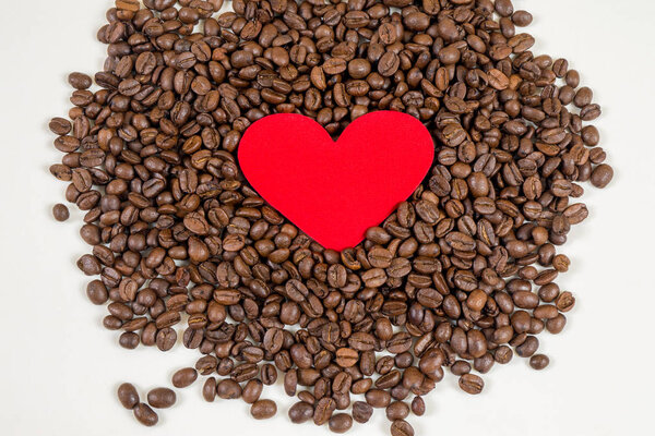 red heart on coffee beans background