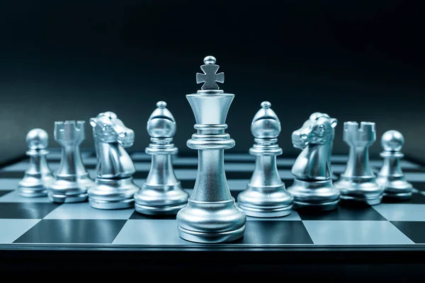 Row of silver chess team on board , black background — Stock Photo, Image