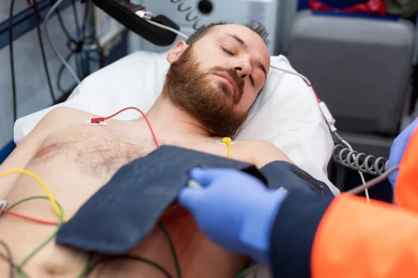 Emergency Doctor Checking Blood Pressure Patient Ambulance Stock Picture