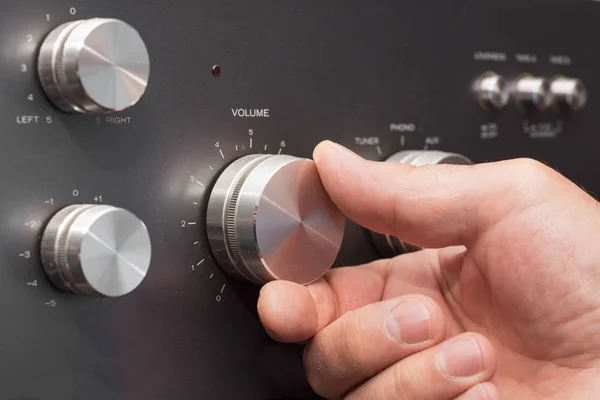 Hand Turning Volume Stereo — Stock Photo, Image