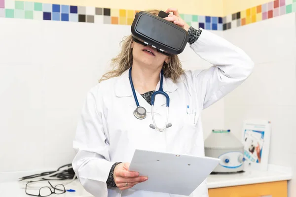 Female doctor wearing virtual reality glasses. Medical technology concept