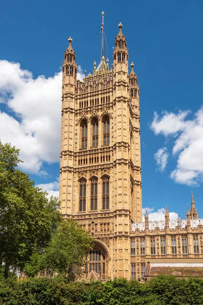 British Parliament Building Westminster in London UK on a brilliant sunny day and a blue sky.