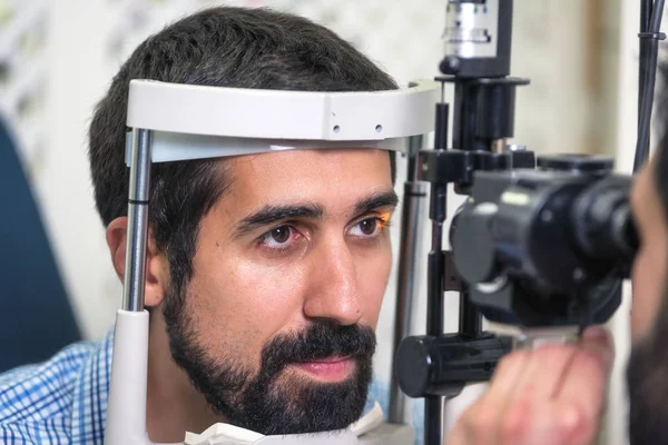 Patient in modern ophthalmology clinic checking the eye vision.