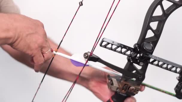 Close up shot of pro archer shooting arrow with mechanic bow. — Stock Video