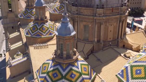 Aerial tilt shot view of dome and roof of famous landmark Basilica Our Lady of the Pillar. Zaragoza, Spain. — Stock Video