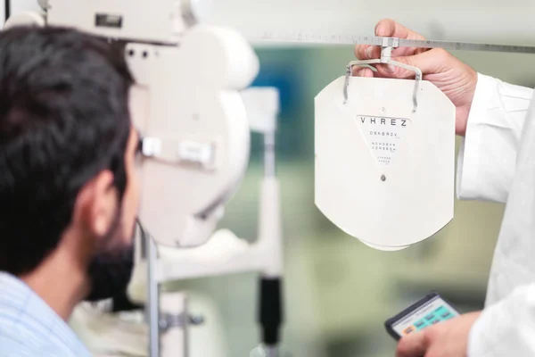 Patient in modern ophthalmology clinic checking the eye vision.