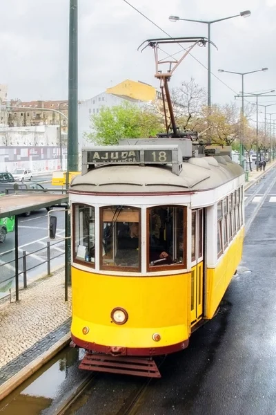 Vintage yellow tram in the city center of Lisbon in a beautiful autumn day, Portugal. — Stock Photo, Image