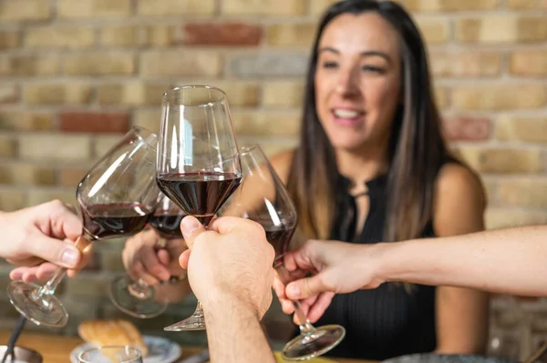 Celebration. Group of friends holding The Glasses Of Wine Making A Toast. — Stock Photo, Image