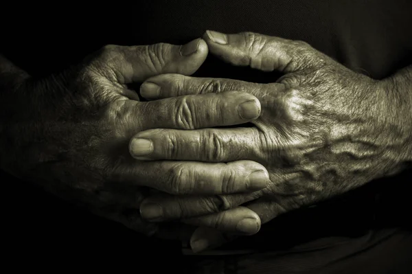 Elder Senior Adult Crossed Wrinkled Hands Black Background Stock Image