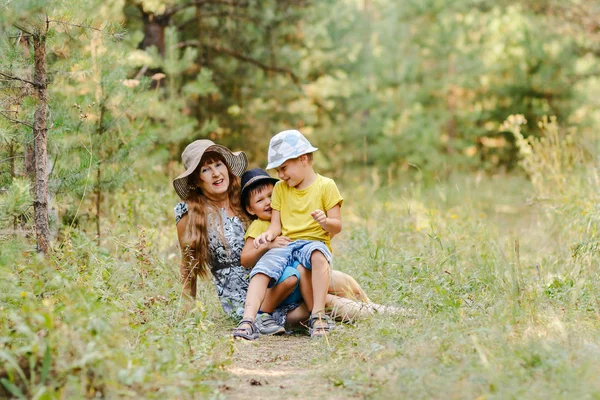 Young Happy Grandmother Two Grandchildren Sitting Forest Lawn Summer — Stock Photo, Image