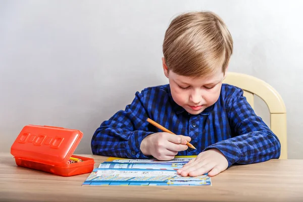 Seven Year Old Boy Draws Coloring Desk First Grader — Stock Photo, Image