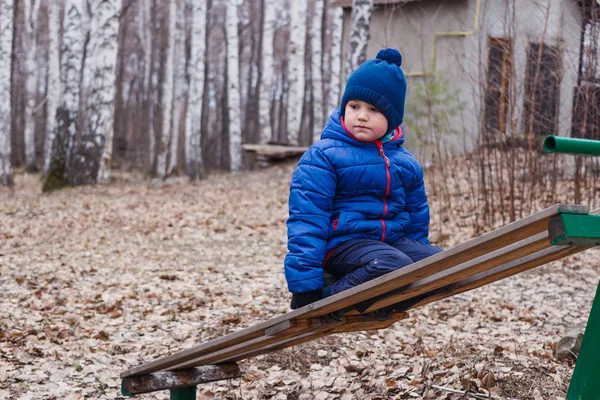 Sad Five Year Old Boy Sitting Wooden Spring Swing — Stock Photo, Image