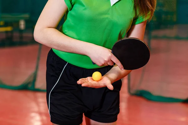 the athlete makes a submission in table tennis, arm and racket close