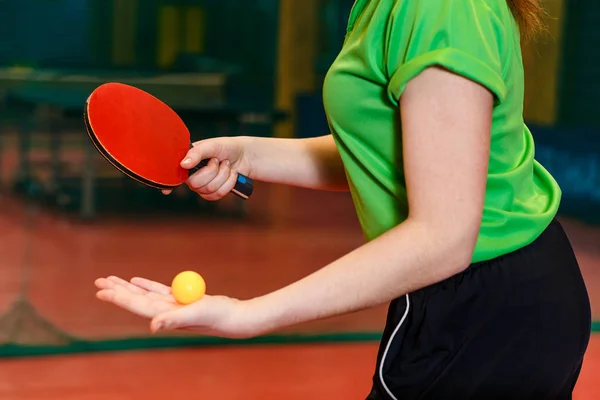 Orange ball for table tennis lies in the palm of a young athlete. the beginning of the game ping pong close Royalty Free Stock Images