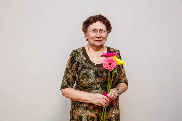 Sixty-year-old woman with wrinkles in glasses — Stock Photo, Image