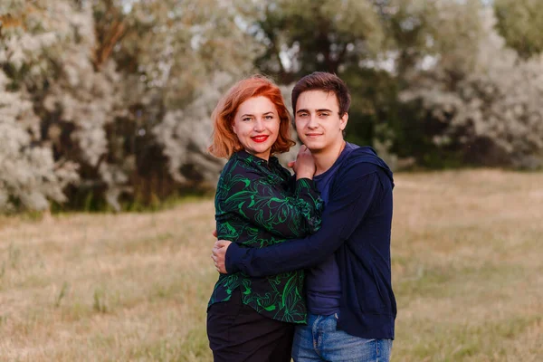 Teen Son Hugs Smiling Mother Summer Outdoors — Stock Photo, Image