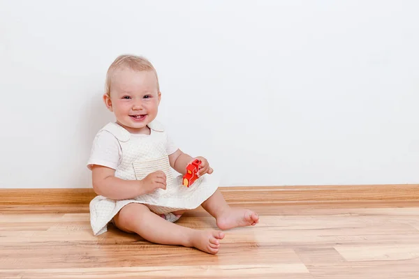 Smiling Baby Girl Sits Floor House Bare Feet — Stock Photo, Image