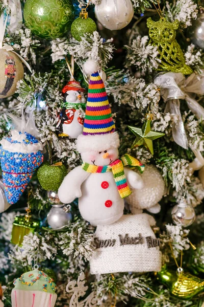 Figure Cheerful Snowman Striped Cap Hangs Christmas Tree Vertical Photo — Stock Photo, Image