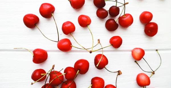 Many Cherry White Wooden Background — Stock Photo, Image