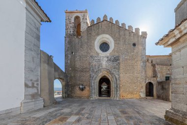 Palmela, Portugal - August, 2015: Santiago Church facade, inside the Palmela Castle. clipart