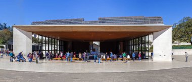 Sanctuary of Fatima, Portugal, March 07, 2015 The Chapel of the Apparitions filled with devotees. One of the most important Marian Shrines and pilgrimage location in the world for Catholics clipart