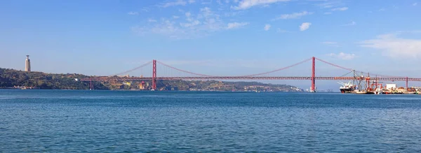 25 de Abril Bridge in Lisbon, Portugal. One of the largest suspension bridges in the world. Connects Lisbon and Almada cities crossing the Tagus River