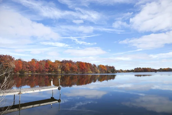 Calm Minnesota Lake Dock Trees Full Autumn Color Blue Sky Royalty Free Stock Photos