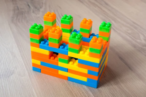 Multi-colored plastic building blocks. Children\'s game constructor.