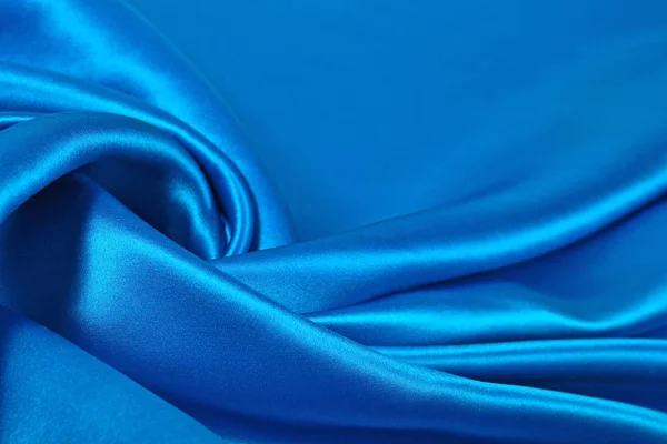 Arka plan doku olarak doğal mavi saten kumaş