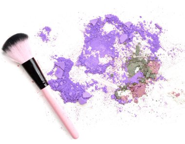 Crushed makeup on white background. The eye shadows.