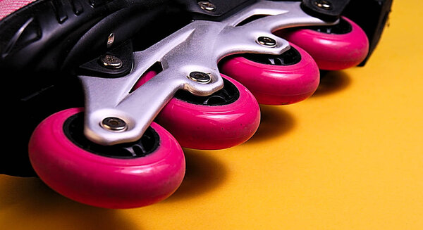 25 degrees close up picture of pink skate wheels