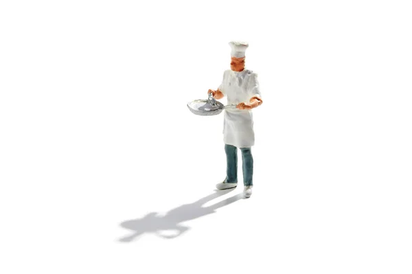 Master chef em toque e avental com uma panela — Fotografia de Stock