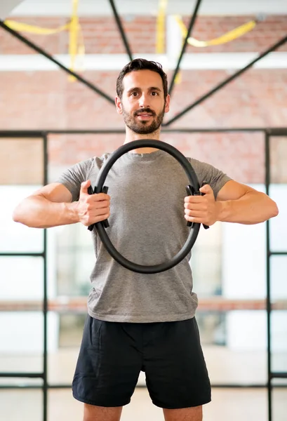 Man training with magic circle at gym